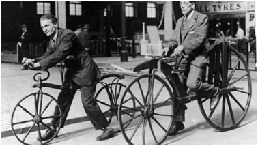 Two men riding Hobby horse and Boneshaker.jpg